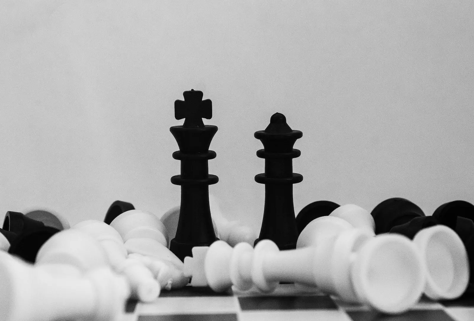 black and white chess piece; dollar cost averaging, investing, dividend stocks