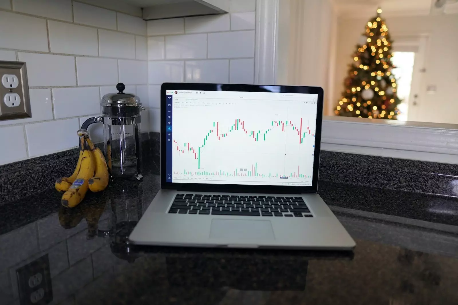 macbook pro on black table; How to find good dividend stocks with TIKR